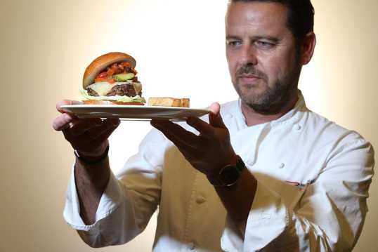 BA Chef Mark Tazzioli with the BA Burger (C) Nick Morrish, British Airways